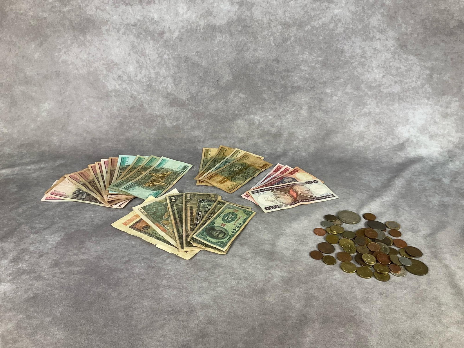 Foreign Paper Money & Coins: Twenty nine pieces of paper money from Brazil, Germany, Japan, and France. Coins are from Mexico, Japan, Brazil, and Canada. All are circulated.