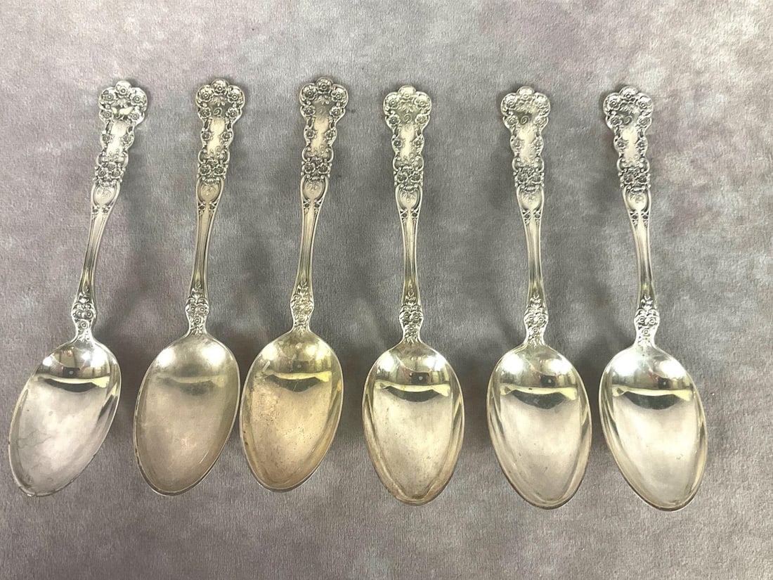 Gorham Buttercup Sterling Soup Spoons: Group of six. Marked sterling. Measures 6 and 7/8 inches long. Monogrammed with E. 8.49 ozt silver. Tarnishing and light scratches.