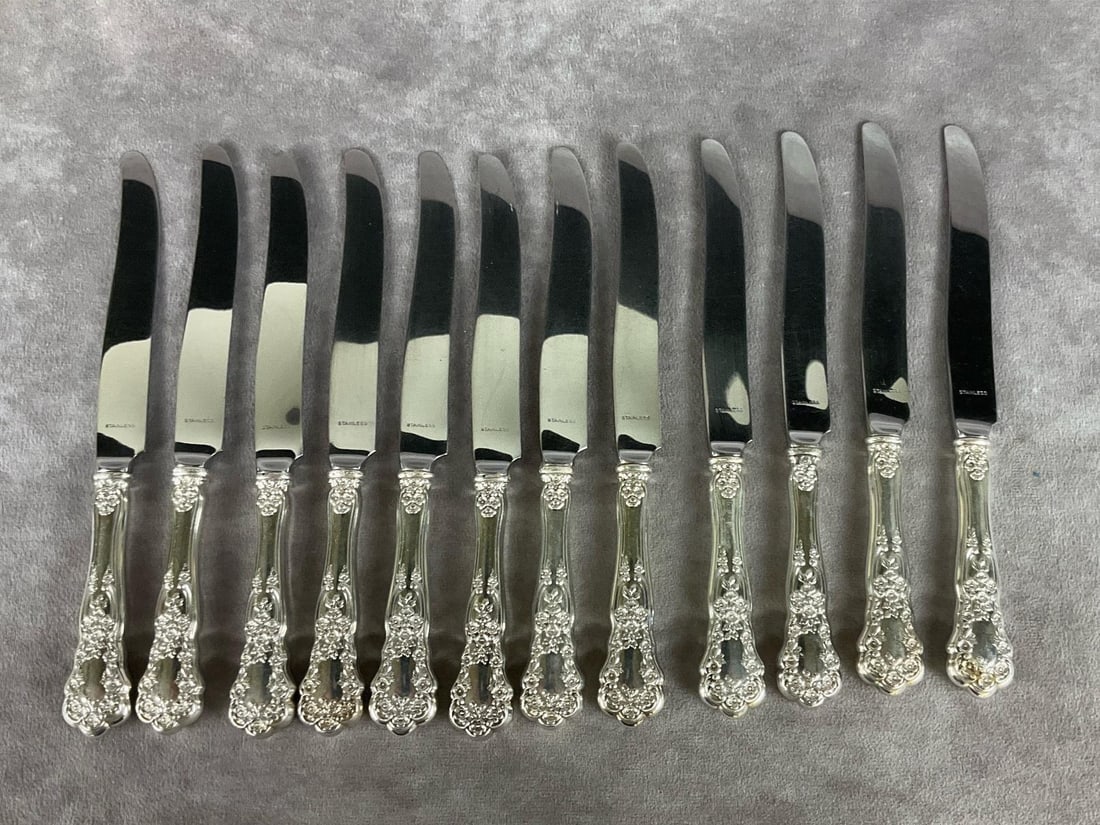 Gorham Buttercup Sterling Knives: Group of twelve. Marked sterling and stainless. Measures 8.5 inches long. Light scratches and tarnishing. Monogrammed.