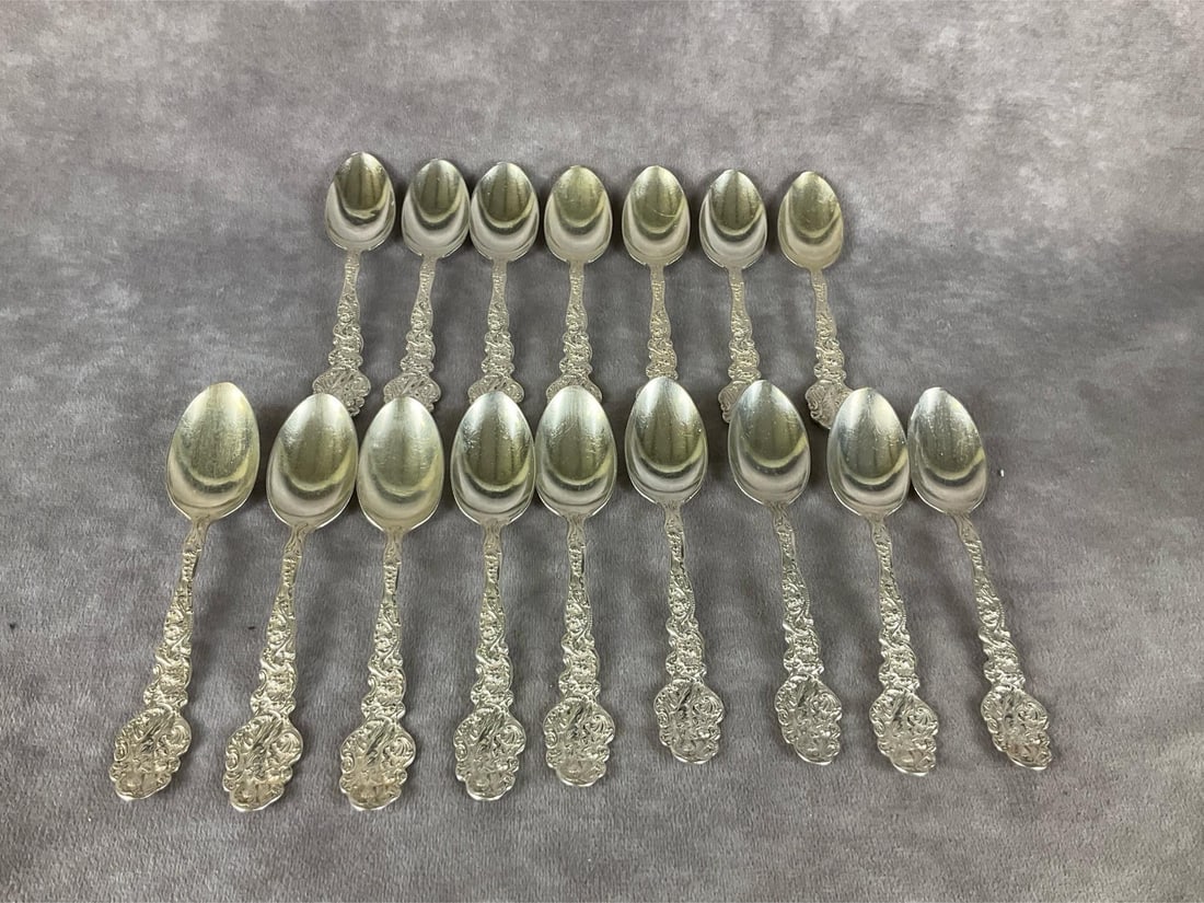 Gorham Versailles Sterling Teaspoons: Group of eighteen. Marked sterling. Measures 5 inches long. Light scratches and tarnishing. Monogrammed on back of handles.