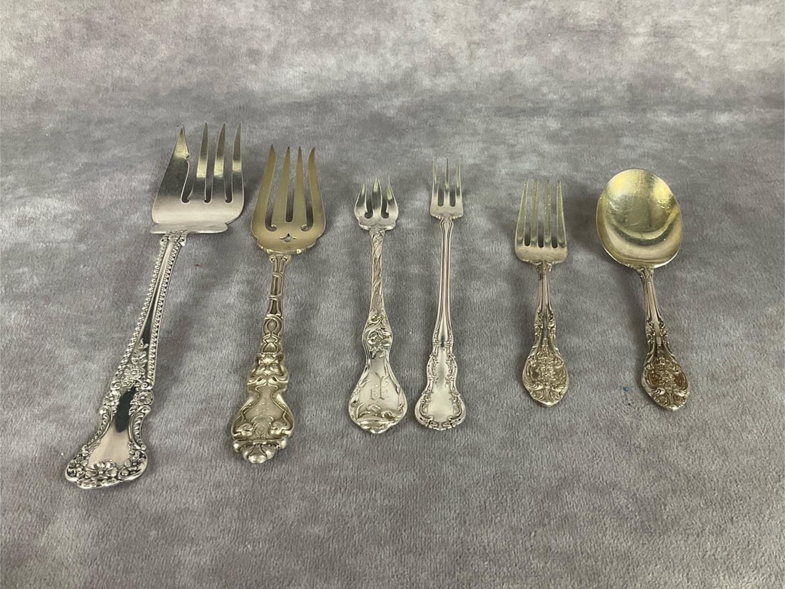 Sterling Silver Variety: Five forks and one spoon. Longest is 7 1/4 inches. Marked sterling. Light scratching and tarnishing. 4.88 ozt silver.