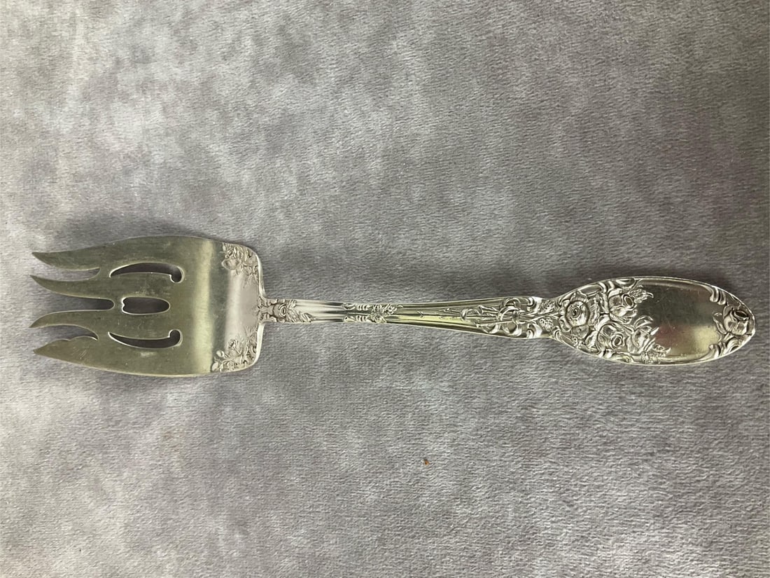 Wallace Sterling Rose Pattern Serving Fork: 8 1/2 inches long. Marked sterling. 1.99 ozt.
