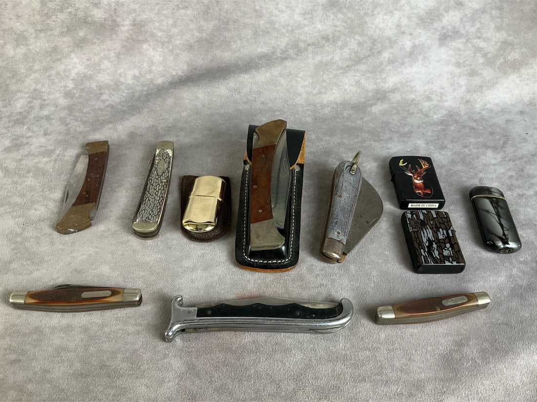 Knives & Lighters: Four lighters total, six knives. All are in poor to fair condition. Includes a camo Zippo. Two Old Timers, four unmarked knives, and Kabar knife. Some knives have rust and verdigris.