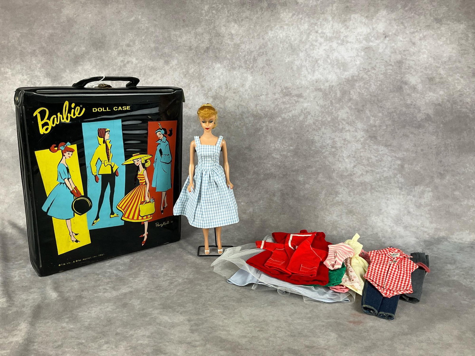 1960s Barbie Doll & Case: 1962 Strawberry Blonde Ponytail Barbie. Comes with 1961 ponytail case and accessories. Some accessories are handmade and some are Barbie trademarked. Doll is marked Japan and has the signature Barbie 