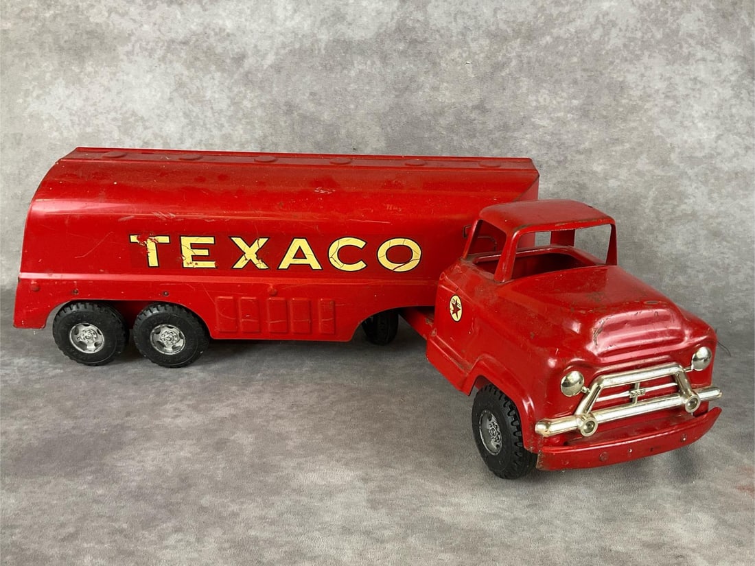 Texaco Buddy L Tanker Truck: Circa 1950s pressed steel. In good condition, minor rust and scrapes, some wear to the logo stickers, and lettering missing. 23 inches long.