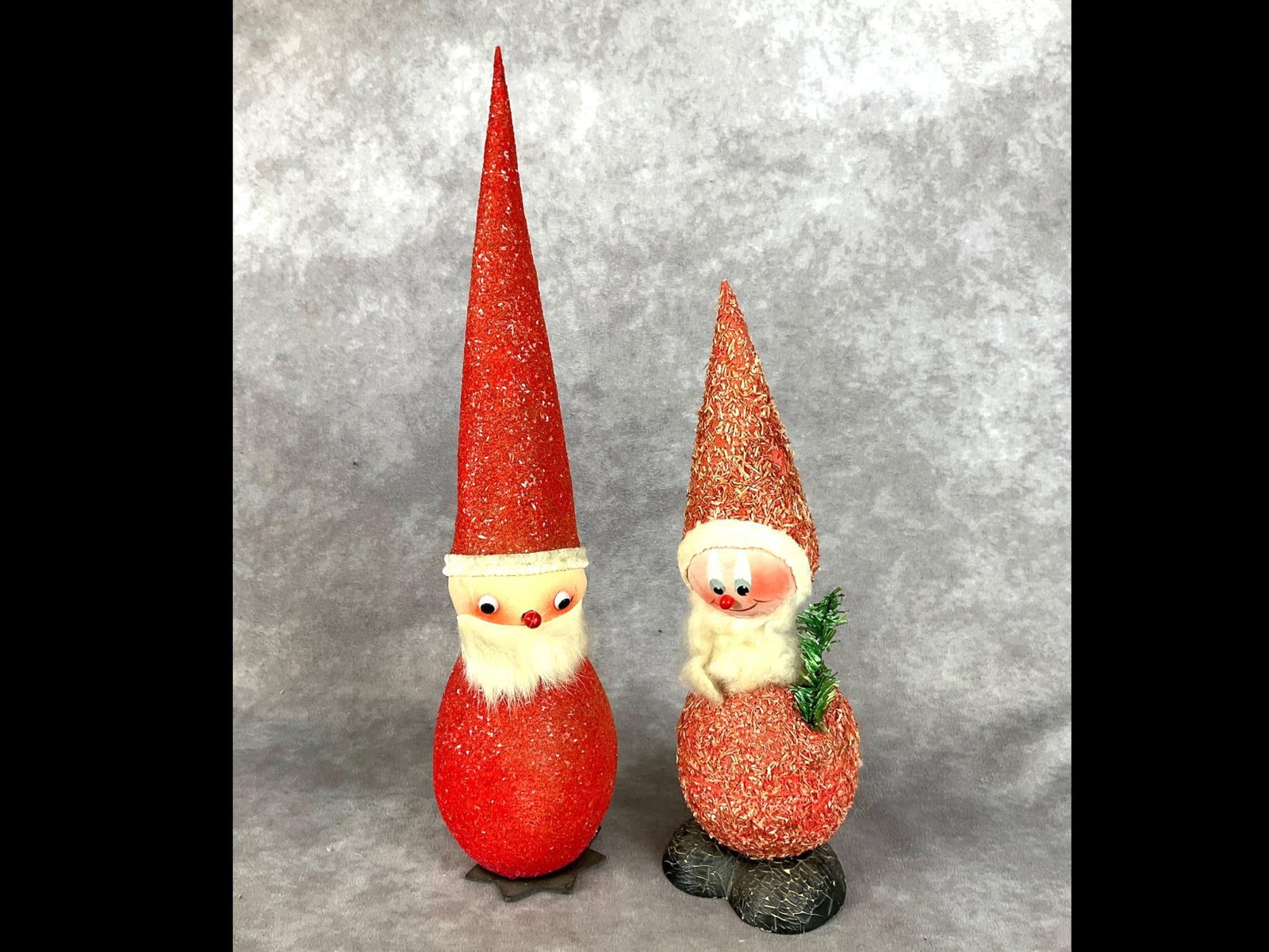 West German Santa Candy Containers: Tallest Santa is marked made in West Germany and has a rabbit fur beard. Good condition with minor crackling to smaller Santa's boots. Measurements are 19 and 9 inches tall.
