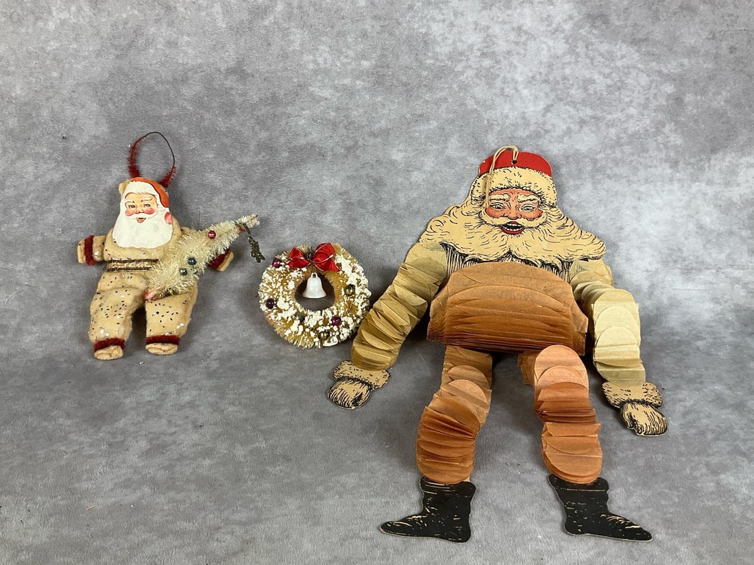 1940s Christmas Decor: Handmade spun batting Santa, bottle brush wreath with bell, and accordion style Santa die cut. All are in fair to good condition. Die cut Santa is 25 inches long.