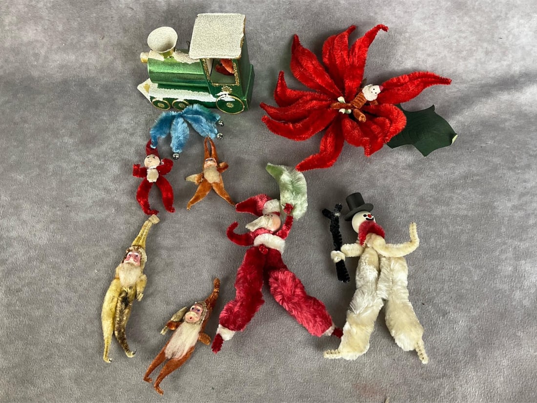 Chenille Christmas Decor: Eight in total. Santa on a train, five smaller Santas, Santa poinsettia, larger Santa and snowman. Two are marked made in Japan. Hand painted faces. There is some fading and stains on some of the chen