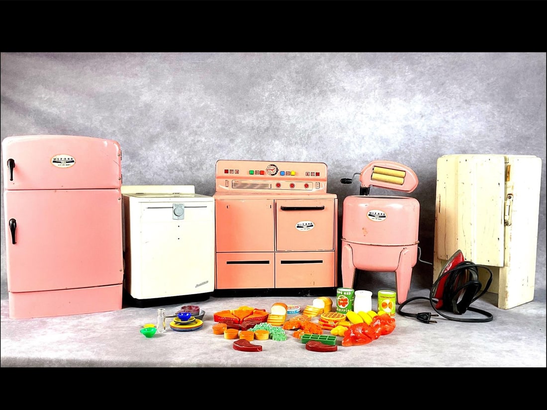 1950's Wolverine Wizard Child Appliances: Includes tin refrigerator, stove, and washing machine, all made by Wolverine. Plastic dishwasher made by Mullins, electric Sunny Suzy iron, a homemade cabinet and an assortment of play foods and dishe