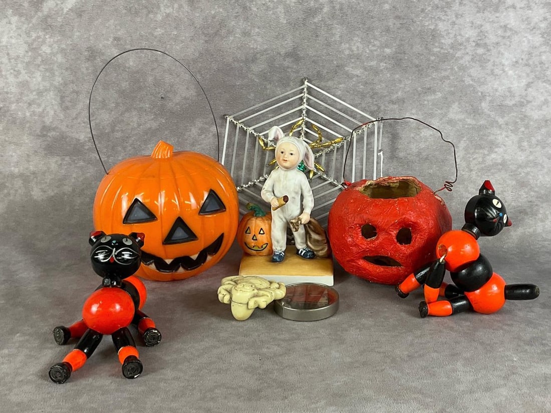 Halloween Through The Ages: Eight pieces total. Two jack-o-lanterns, one plastic and one paper mache. Two wooden cats, a glass spider web, a dexterity puzzle, a plastic spider and a River Shore figure. Tallest piece is 7.5 inche