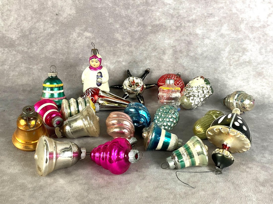 Early Glass Christmas Ornaments: Total of twenty one. Variety of bells, cones, and other shapes. The majority are marked Shiny Brite. Colors are vibrant, with some paint loss. Largest ornament is 4 inches long.