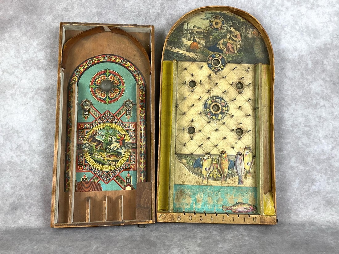 Victorian Lithographed Bagatelle Games: Circa 1870. Both games are lithographed, one with a family garden scene, and another with a deer hunting scene. Smaller game has functioning spring and bell. Solid wood with some original pieces inclu