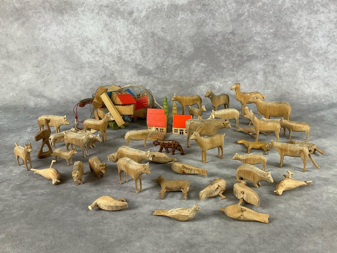 German Made Wooden Animals and Houses: Large lot of different wooden animals including goats, horses, birds, foxes, pigs and cows. Two bags of wooden homes, trees and stepping stones. Bags are marked Eastern Germany. Largest animal is thre