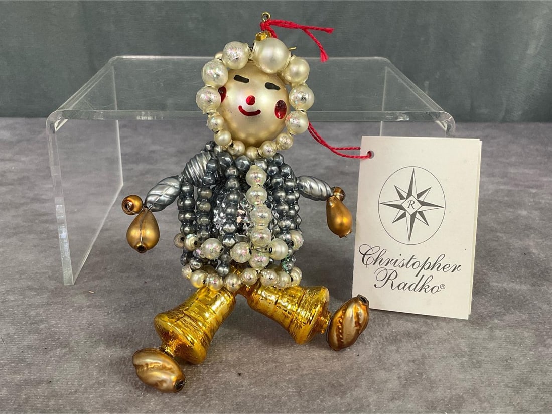 Christopher Radko Chilly Eskimo: 1999 beaded mercury glass ornament with original tag. 4x2.5 inches. Discoloration spot on back of head. Otherwise good condition.