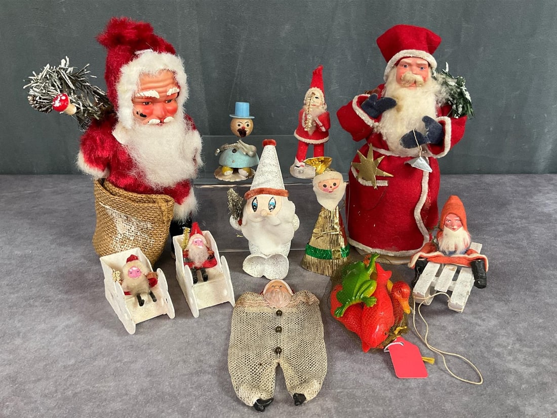 Santa Figures & More: Felt Santa candy container, missing bag and right hand is torn. 1930s celluloid Santa face mesh candy bag. Early 1900s German Santa on sleigh, composite head and boots, rabbit fur beard. Two clay face