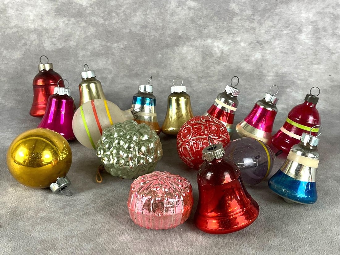 Christmas Bells & More: Group of sixteen. Assorted colors. Many bells, four bulbs and a group of grapes. Largest is 3 inches. A couple of the bells are marked shiny brite. Two ornaments are missing hangers.