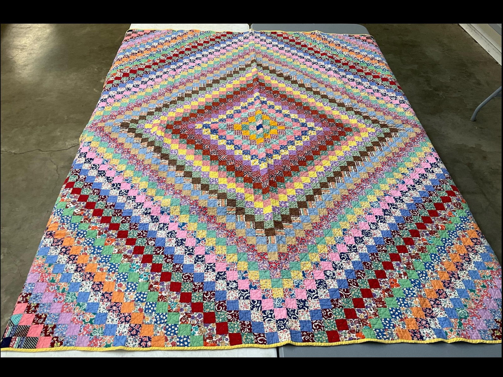 Hand Stitched Diamonds Quilt: Good array of colorful fabrics. Some softening from washing but overall good condition. 70 inches wide x 80 inches.