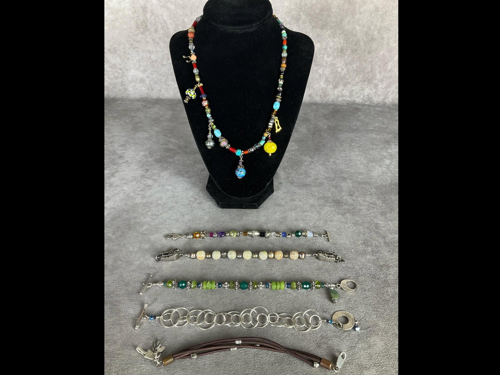 Saki Brand Boho Jewelry: Colorful necklace and five different bracelets. All marked Saki 925. Necklace is 18 inches. All in good condition.