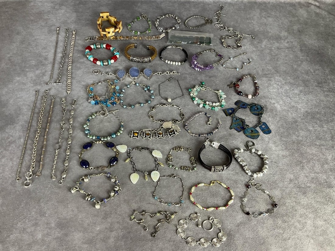 Sterling Silver Bracelets & More: Total of 2.61 ozt silver in weighable bracelets. Along with quite a few that have silver components and are marked .925. All are in good condition.