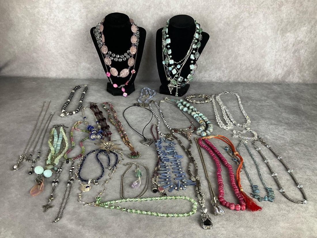 Necklaces & Bracelets: Two marked Saki 925. Faceted crystal beads, polished stone beads, pearls, and much more. Some necklace chains and pendants marked .925. One clasp is marked .585 ( 14k ). Another is marked Annie Adams 