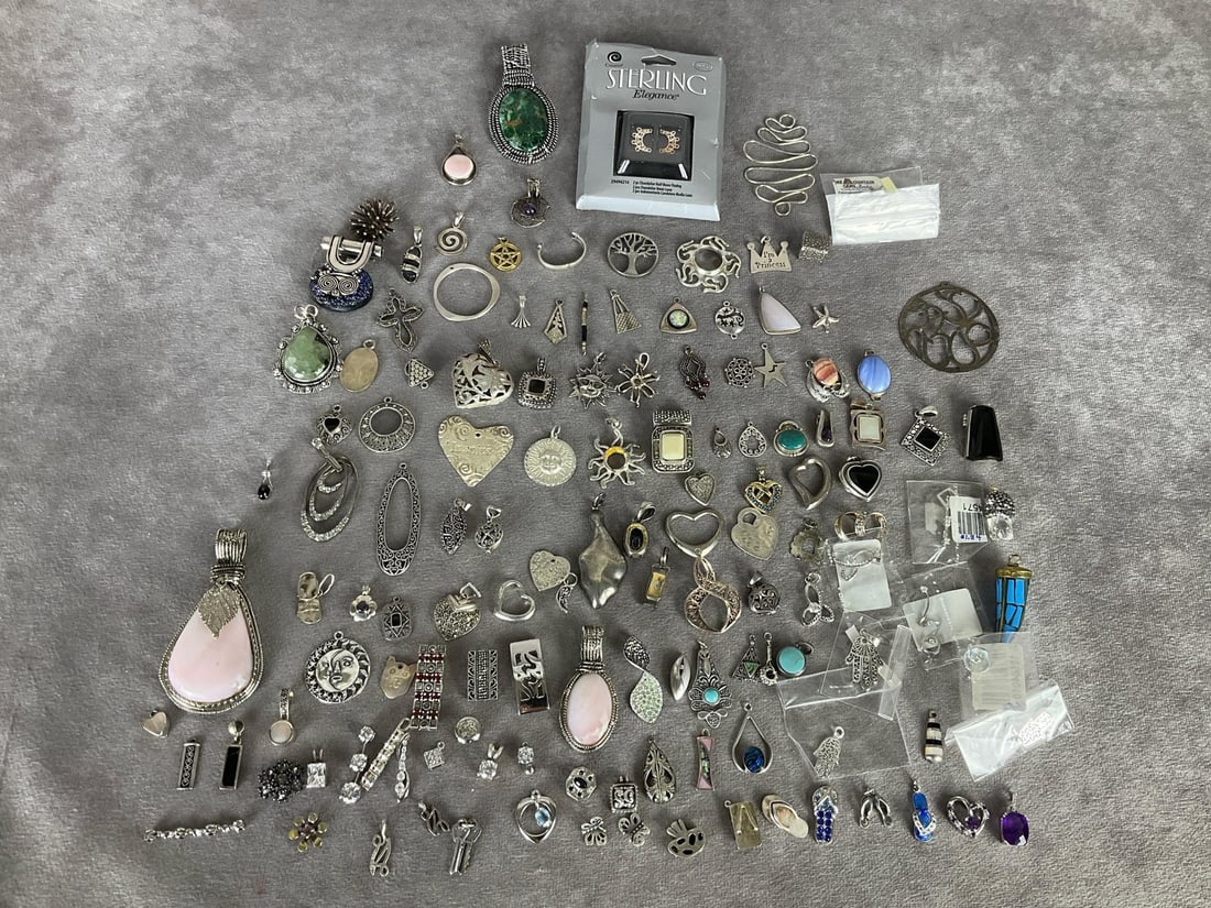 Silver Pendants & Charms: Many marked .925 but not all. None tested. Several are missing stones, some broken rings or attachments, some tarnishing, but otherwise good condition. Largest pink stone pendant is 3 inches tall.