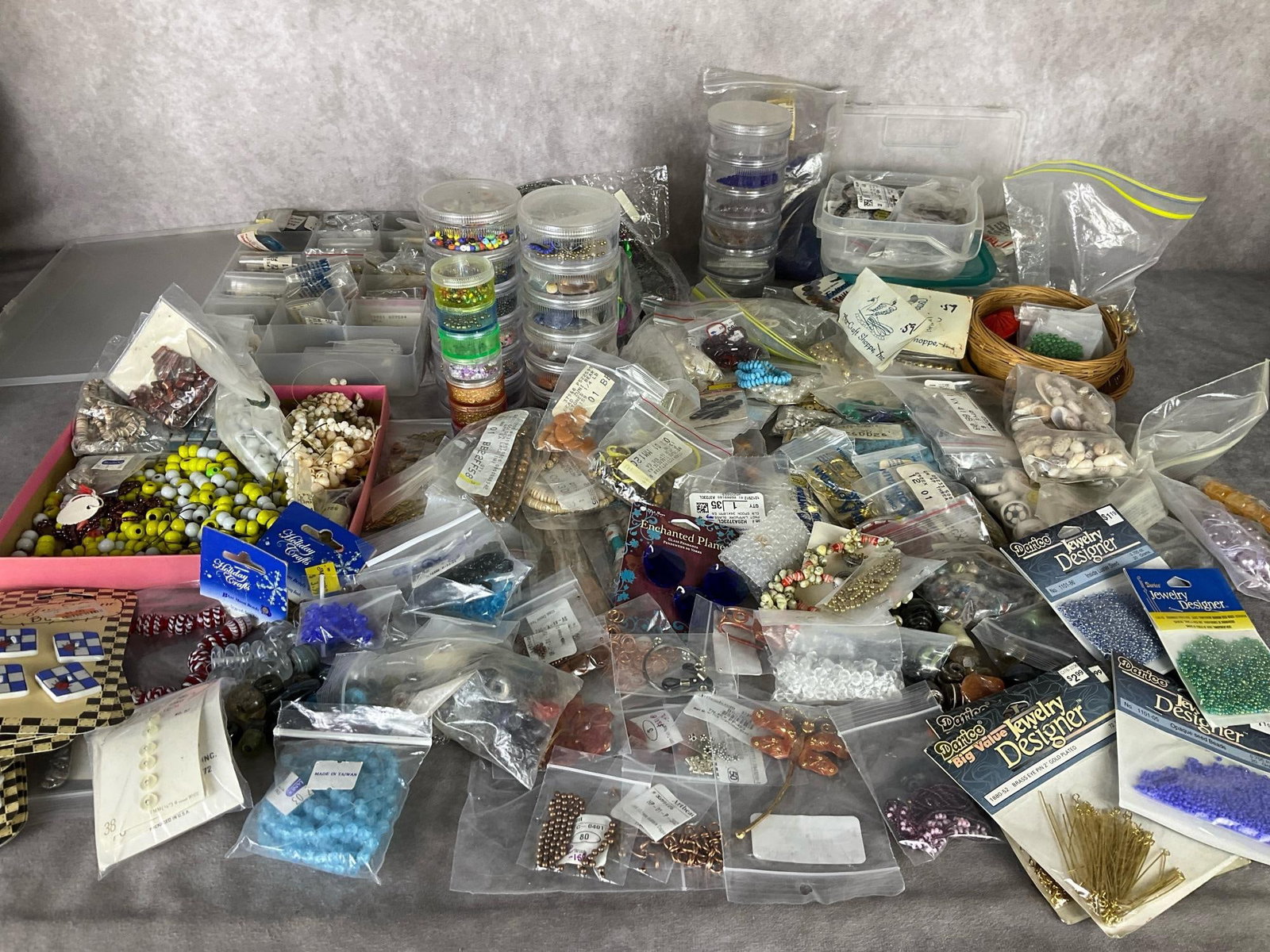 Jewelry Making Supplies: Seed beads, shells, rock and glass beads, buttons, stamped metal charms, findings, pendants, and much more. Overall good condition.