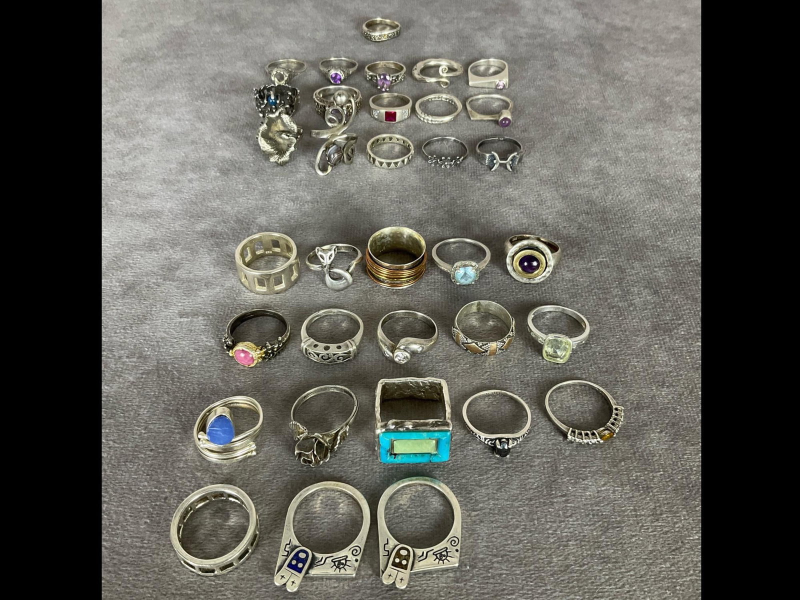 Sterling Silver Rings: Size 7 to 7.5. Total of 34 rings. Fifteen test as silver but are not marked. Others are marked .925 or sterling. One is missing small stones and one filigree mount is missing a center stone, other rin