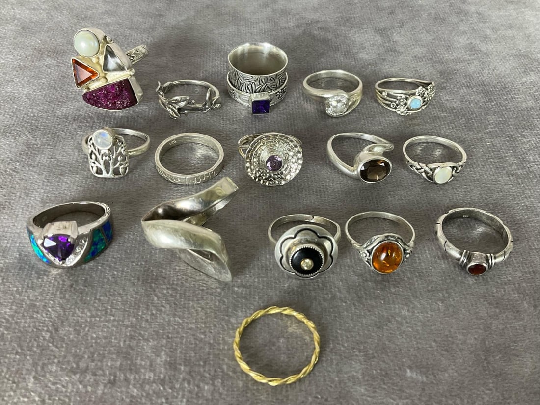 Sterling Silver Rings: Size 8 to 8.5. Total of 16 rings, one is vermeil. Variety of stones and designs. Marked either .925 or sterling. Good condition.