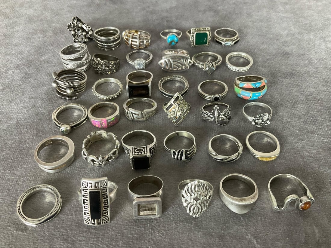 Sterling Silver Rings: All size 6 to 6.5. Total of 36 rings. A variety of stones and designs. Marked either 925 or sterling. Good condition.