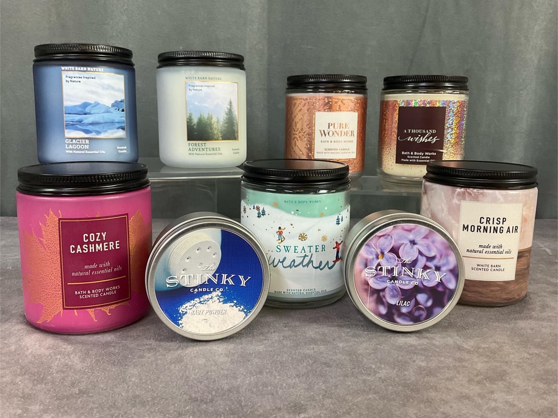 White Barn and Bath and Body Works Candles: Group of nine with boxes. Three 7 ounce White Barn Nature Essential Oil Candles. Scents are Crisp Morning Air, Glacier Lagoon, and Forest Adventures. Four Bath and Body Works 7 ounce essential oil can