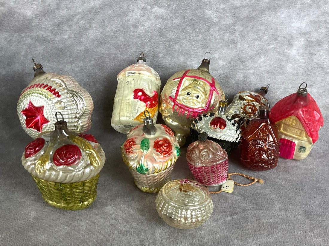 German Blown Glass Ornaments: Eleven total. Double indent star ornament, Santa in window, four flower baskets, and four houses. All have paint loss, and some have broken tips. Most are in good condition for age. Largest measures 4
