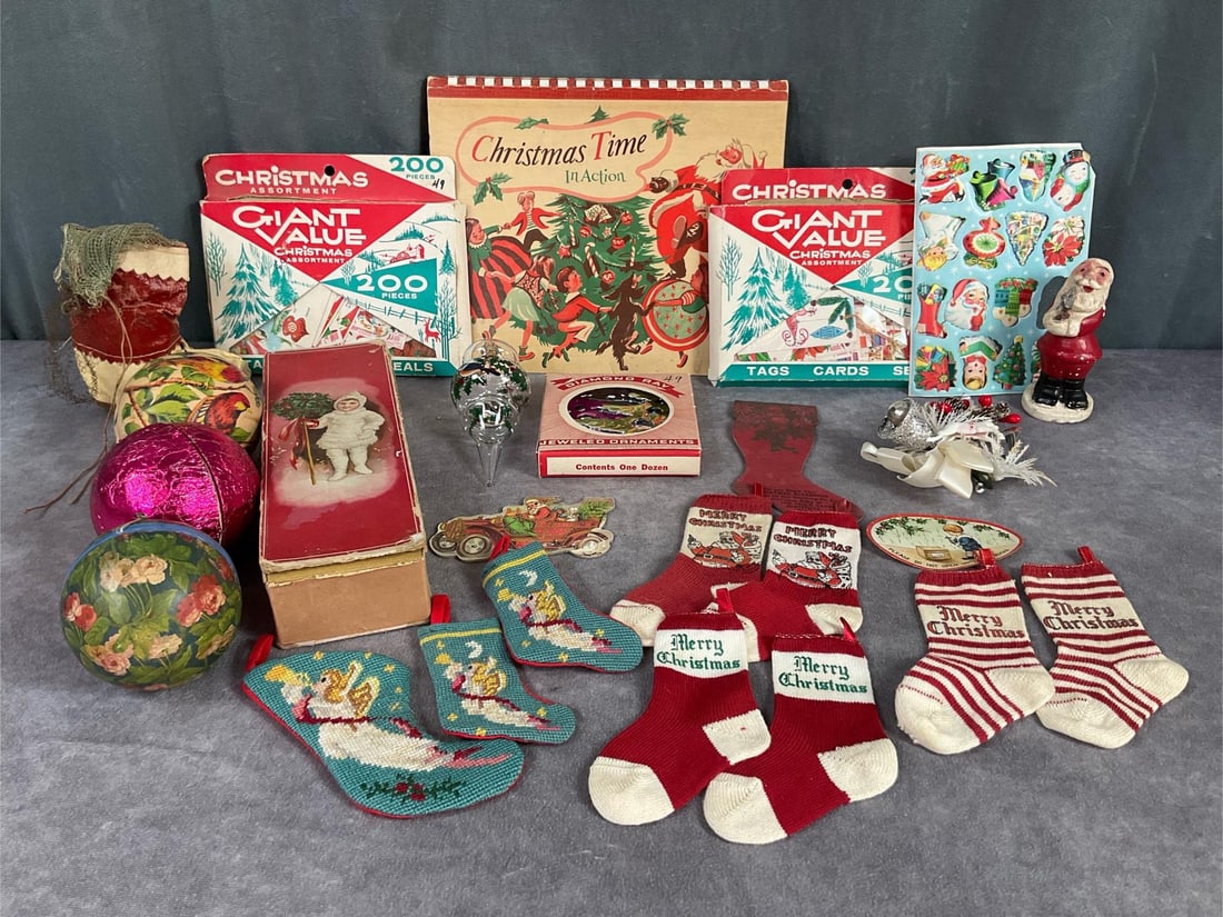 Mini Stockings & Other Christmas Decor: Six 1950s mini knit stockings, Santa boot candy bag, two boxes Dennison seals etc counts not verified, three Germany candy containers two are not opened, 1949 pop up book, and more. Book is 10 inches 