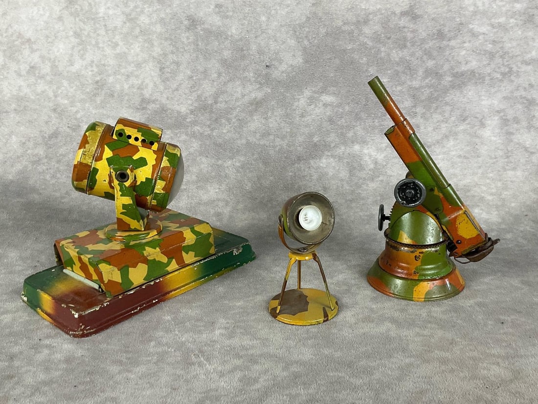 Tin Military Toys: Three pieces. Cannon is not marked, search light is believed to be tippco but is not marked, made in Czechoslovakia. Smaller spot light is marked Hauser Germany. All are in fair to good condition. Lar