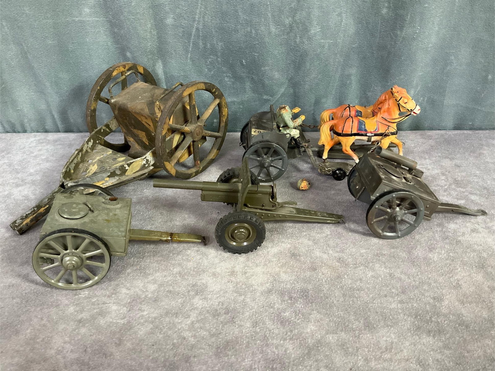 Hausser Cannon & More: 1930s field gun marked Hausser Germany on barrel, two field kitchens unmarked, horse drawn caisson, and unmarked large camo caisson. Horses have been repainted, soldier is cracked and broken head. One