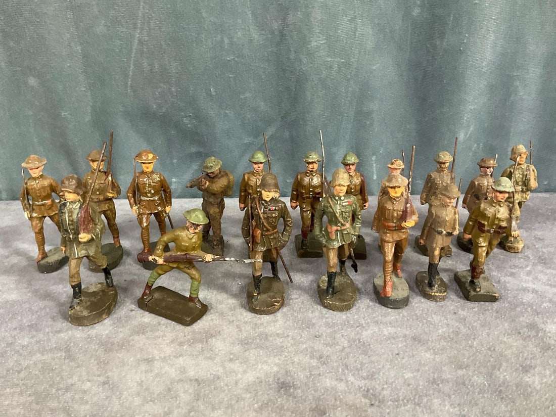 1930's Elastolin Marching Soldiers: Eighteen American and British soldiers marked Elastolin and Lineol. Cracking, paint loss, repainted, and broken hands on some. Measures 3 inches tall.