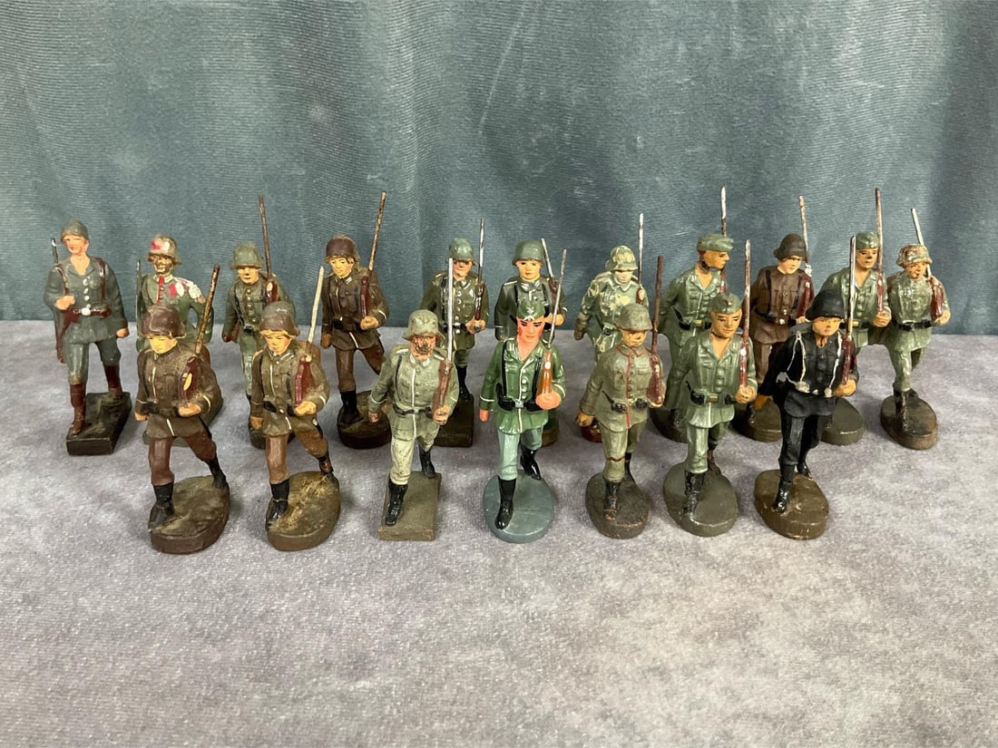 1930's Elastolin Soldiers: Eighteen German, American, and British soldiers marked Lineol, Elastolin, Leyla, and Schusso. Cracking, paint loss, repainted, measure 3 inches tall.