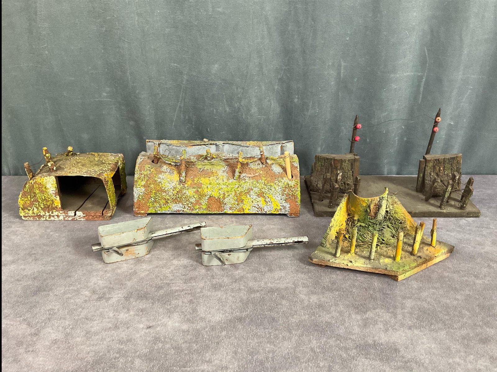 1930's Trench and Bunker Sections: Four pieces made of wood, composite, and cardboard most are unmarked, one marked D.R.G.M. Two gunner tops to tanks made of wood and metal. Overall good condition. Largest pieces measures 9.5 inches lo