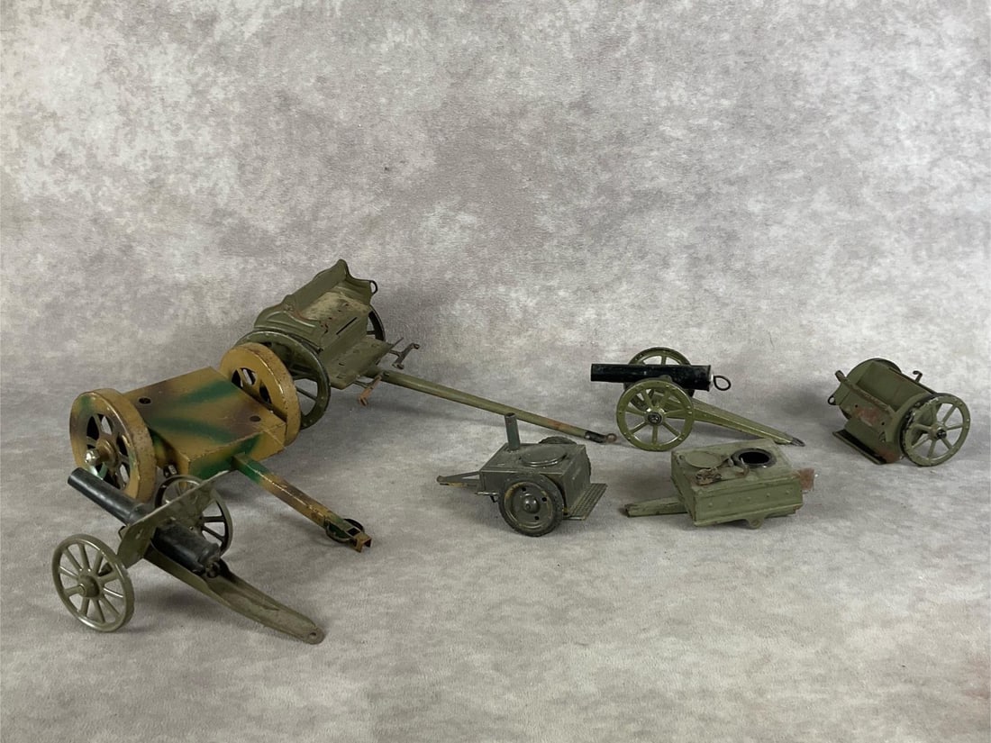 Tin Toy Cannons & Wagons: Group of seven for Elastolin and Lineol composite soldiers. All are tin, with rust and paint loss. Longest wagon measures 9 inches long.