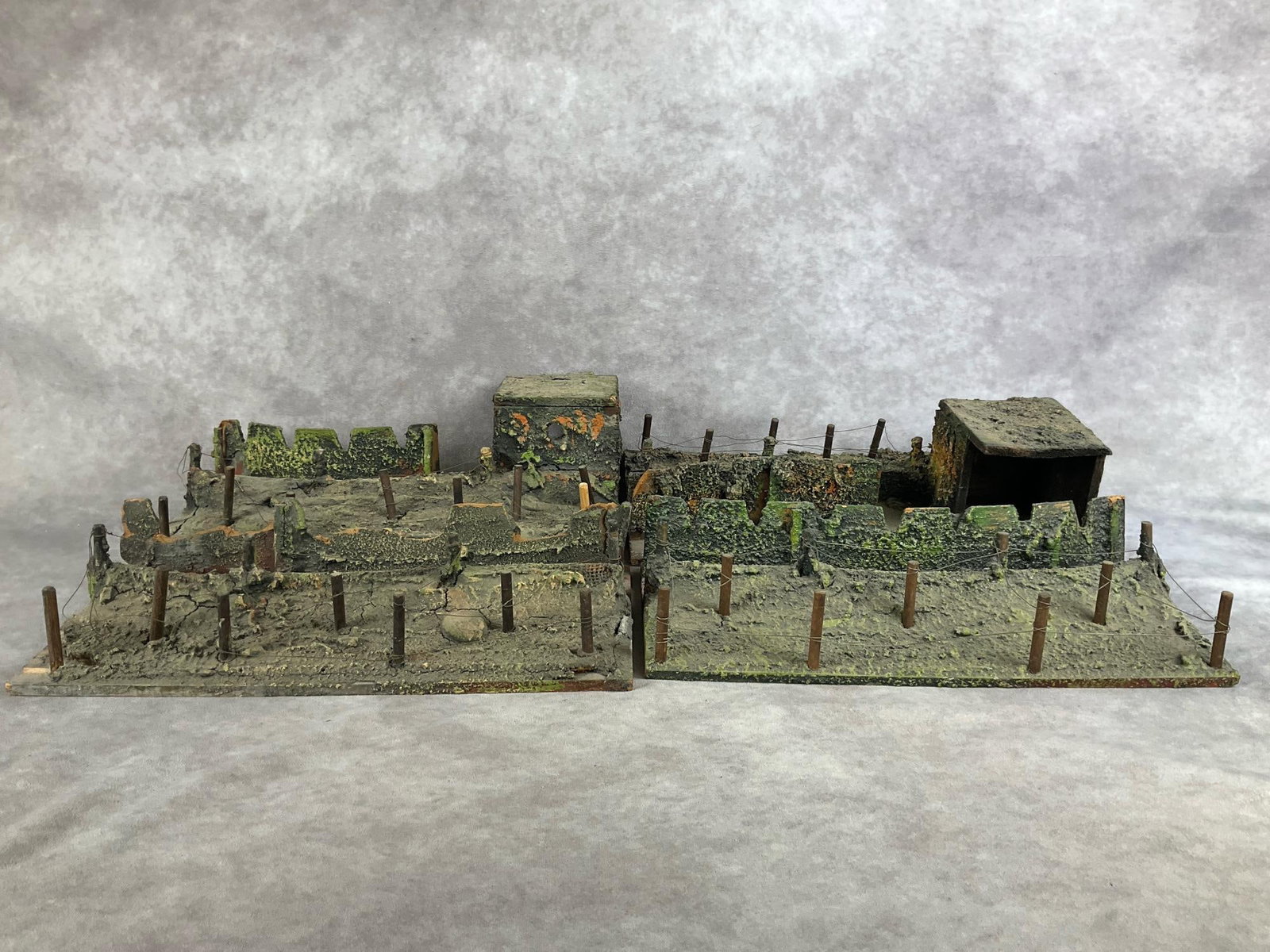 Elastolin Trench Sections: 1930s. Two trench sections and two bunkers. Made of wood and composite. All marked Elastolin on bottom. Cracking and chipping to composition, and a replacement post on one. Bunkers and trenches appear