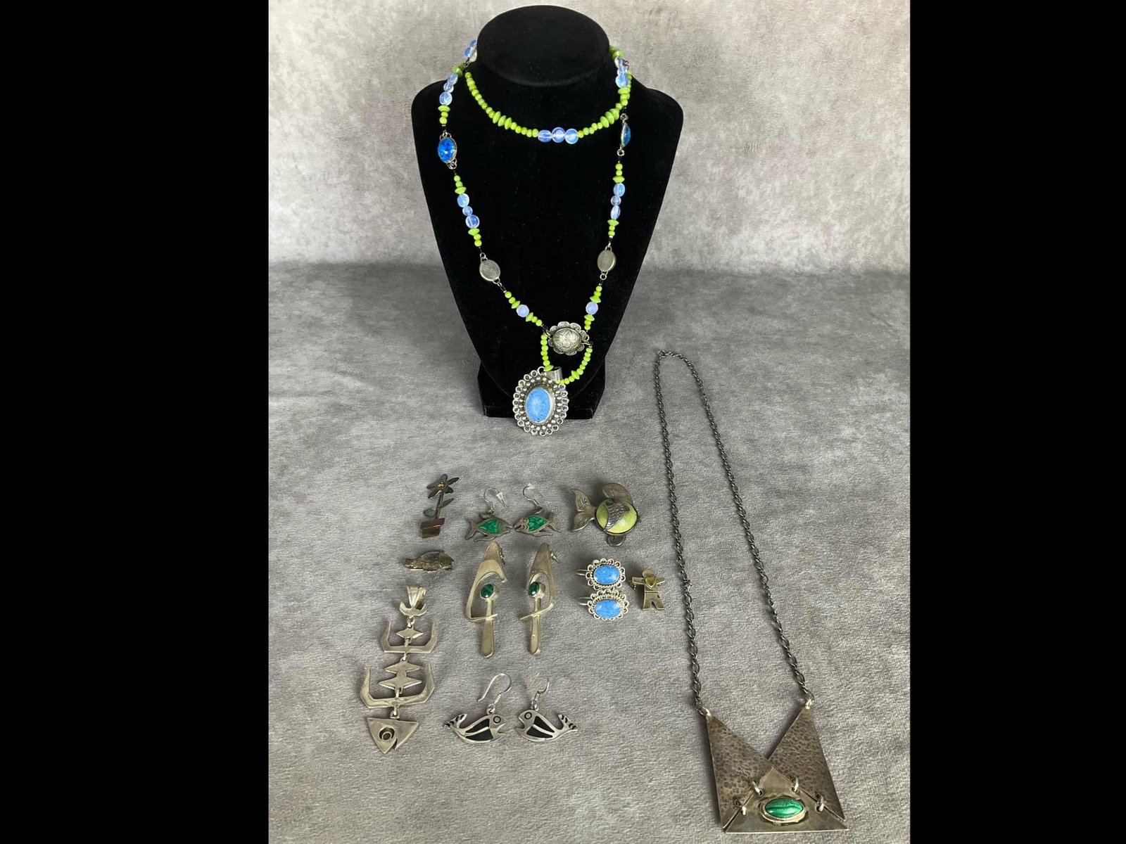 Mexican Sterling Jewelry & More: Several pieces marked Mexico .925 but not all. Malachite stone in necklace is cracked. All earrings are pierced and do have matches. Silver fish pendant is 3.5 inches long. Good condition except where
