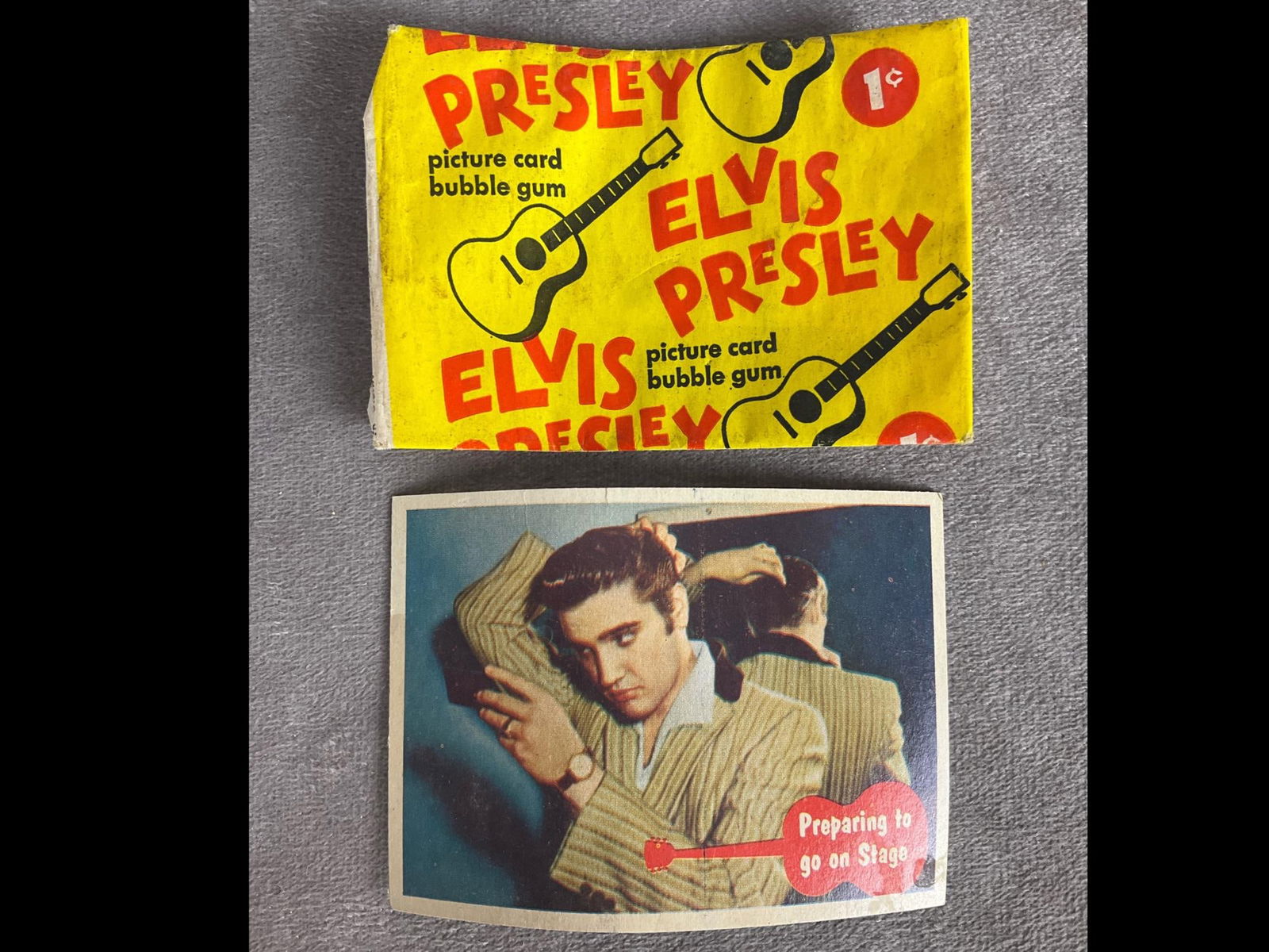 1956 Elvis Presley 1 Cent Picture Card Bubble Gum: Opened with Topps Elvis card #45 Preparing To Go On Stage. Card is bowed but in otherwise good condition. Wrapper is in good condition with most wear to edges.