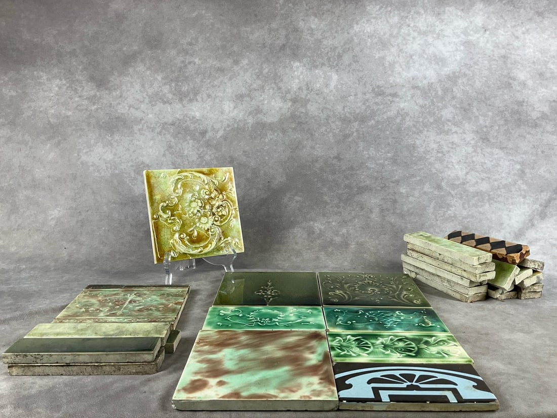 Cambridge Ceramic Fireplace Tiles: Group of five square tiles, four half tiles, and nineteen border tiles. Most are marked Cambridge, others are marked mosaic or not marked. Tiles have a variety of colors and designs dating them to the