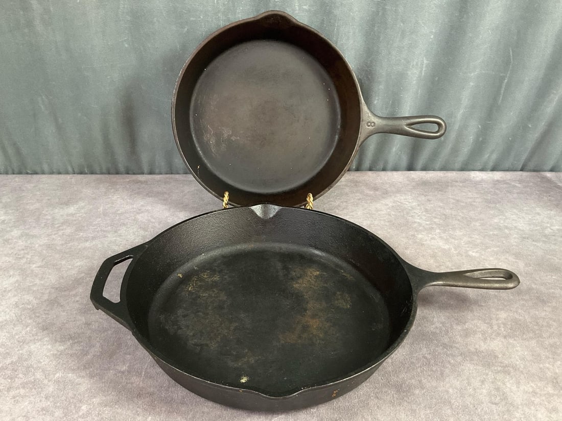Vollrath and Lodge Skillets: Two cast iron skillets, older Vollrath marked 8 on top of handle and N T on the bottom with heat ring, good condition. Modern Lodge 10 inch skillet, marked on bottom, rust showing through on inside an