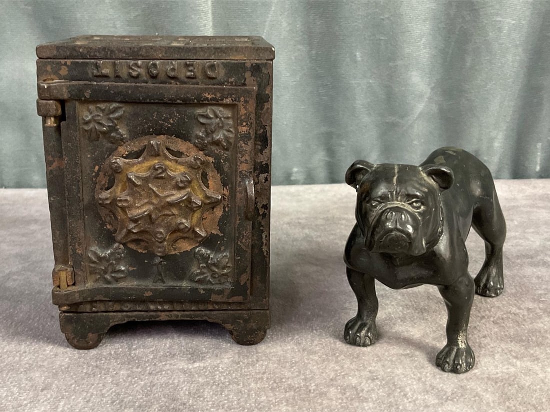 Keyser & Rex Cast Iron Bank: Circa 1885 cast iron bank with double combination lock. Marked Security Safe Deposit on front and 100 on bottom. Bank is unlocked, combination is unknown. Cast metal bull dog figure. Bank has rust and