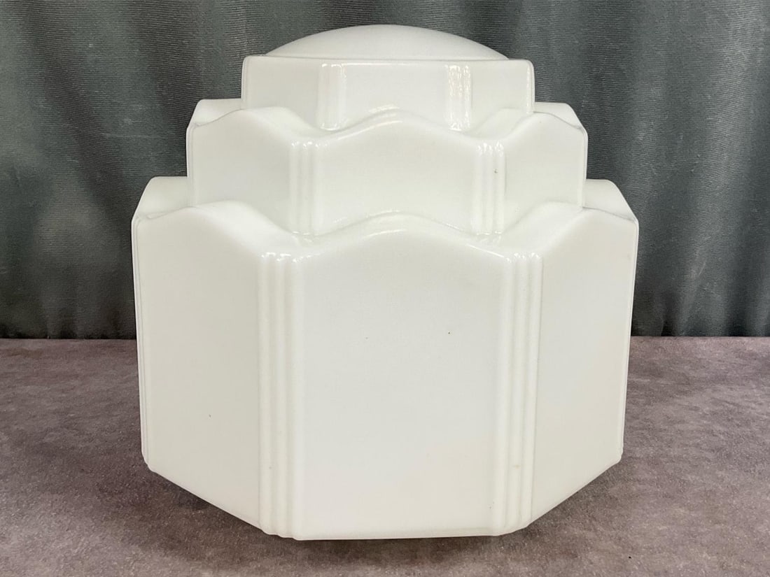 Art Deco Skyscraper Lamp Shade: 1920s milk glass skyscraper style ceiling light shade in good condition. Measures 7.5 inches tall and the opening is 3.75 inches in diameter. A few scratches on two panels.