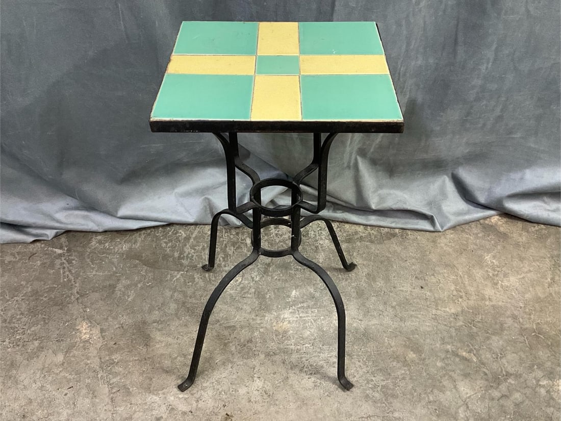 Wrought Iron Tile Top Table: Early 20th century iron base side table with cream and turquoise tile top. Good condition, crazing to tiles. Measures 11 inches wide x 11 x 19 inches high.