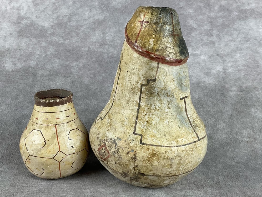 Shipibo Conibo Peruvian Pottery: Two vases. According to consigner, family members were oil explorers in Peru during the 1930s and 1940s. These pottery pieces are believed to be from the Shipibo tribe. Appears in fair comditon. Both