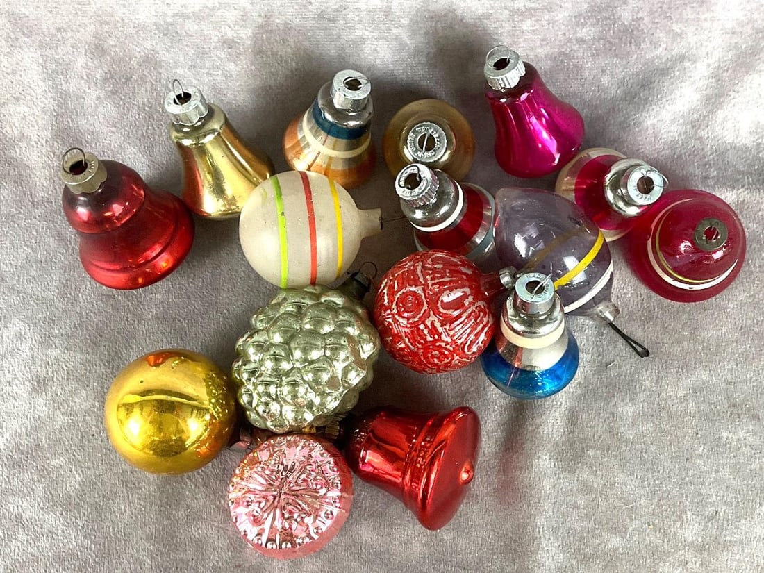 Christmas Bells & More: Group of sixteen. Assorted colors. Many bells, four bulbs and a group of grapes. Largest is 3 inches. A couple of the bells are marked Shiny Brite. Two ornaments are missing hangers.
