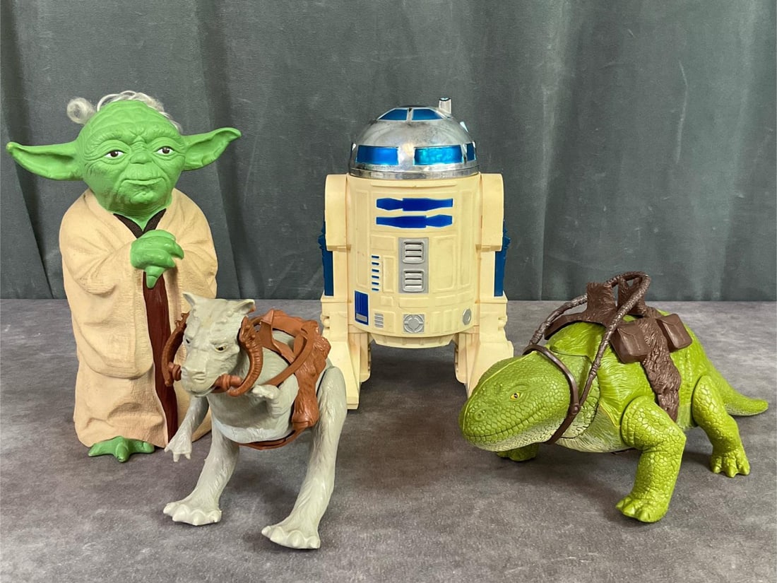 Original Star Wars Figures: 1978-1981. Includes Yoda rubber hand puppet, Dewback, Tawn Tawn, and R2D2. Yoda hand puppet is manufactured by Lucas Film, all other toys are Kenner. Figures are complete and in good condition with so