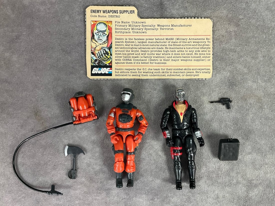 1983 Destro & 1985 Barbecue: Lot of two G.I. Joe figures. One is Enemy Weapons Supplier code name Destro. Swivel arm version, complete with original accessories and file card. Loose torso and legs. The other is Barbecue. Swivel a